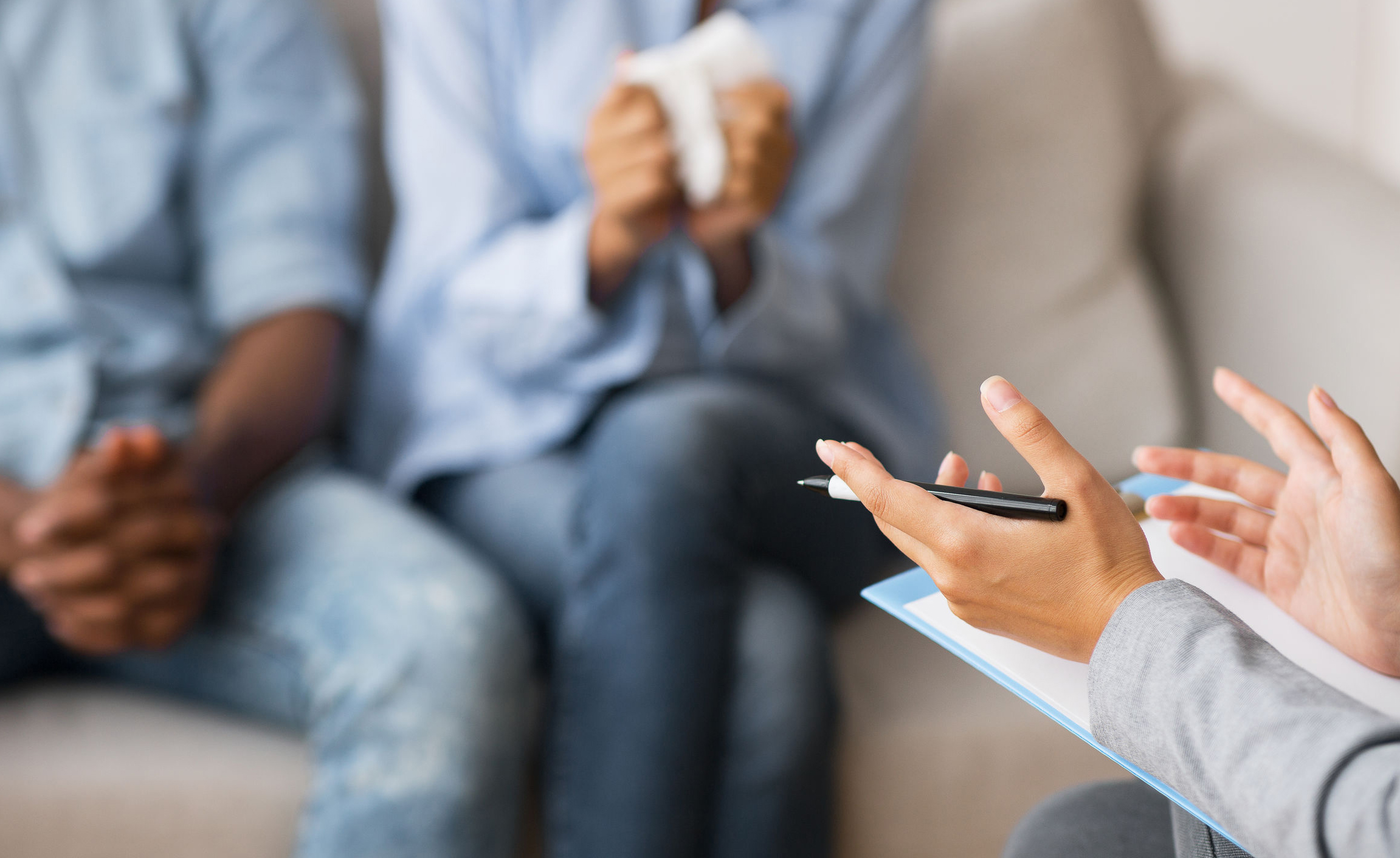 Marriage Therapist Giving Advice To Young African American Husband And Wife Mediation in Charleston
